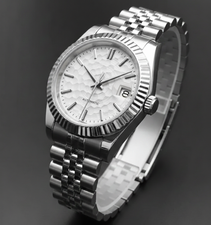 The Artisan Watch, featuring a white textured dial in a 36mm stainless steel case